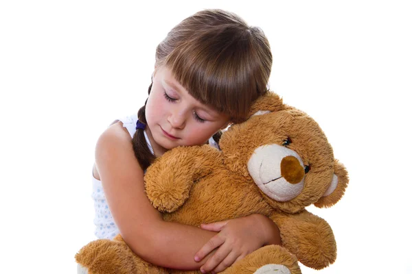 Entzückendes Kleinkind Mädchen umarmt einen Teddybär — Stockfoto