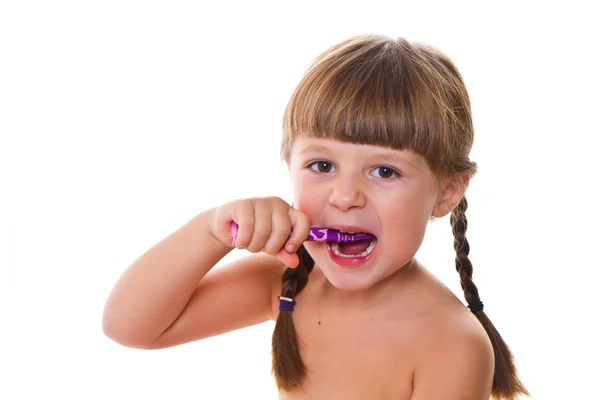 Higiene dental. feliz niña cepillándose los dientes —  Fotos de Stock