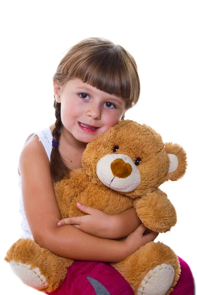 Adorable niño niña abrazando un osito de peluche —  Fotos de Stock