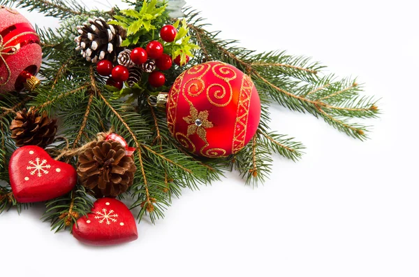 Christmas balls and fir branches with decorations isolated over — Stock Photo, Image