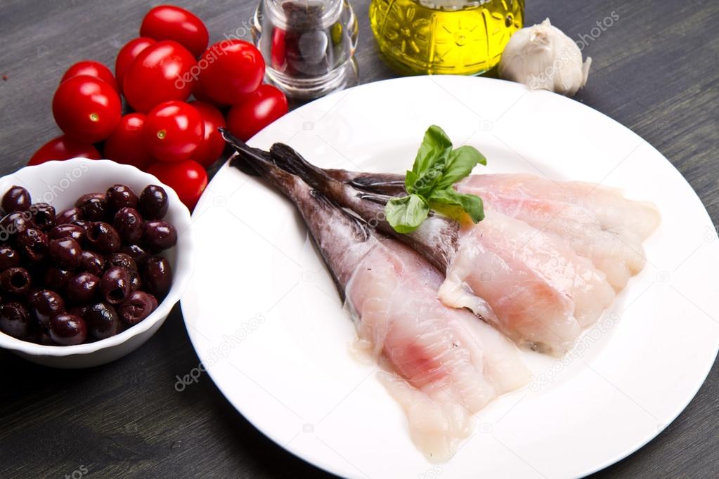 Fresh fish monkfish with ingredients