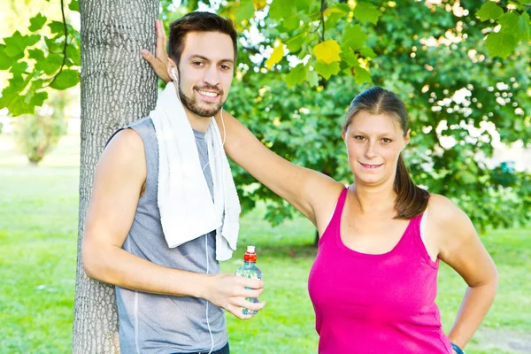 A couple drinking water after sport — Stock Photo, Image