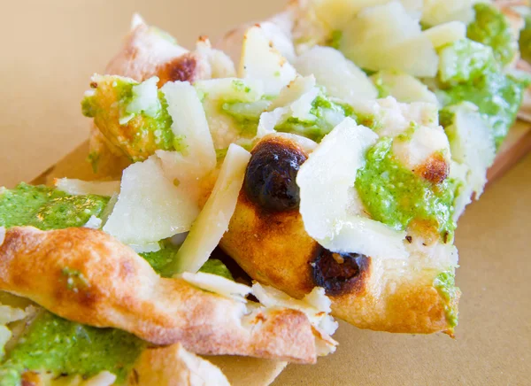 Pieces of focaccia with pesto and cheese — Stock Photo, Image