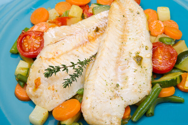 fresh cod on bed of mixed vegetables