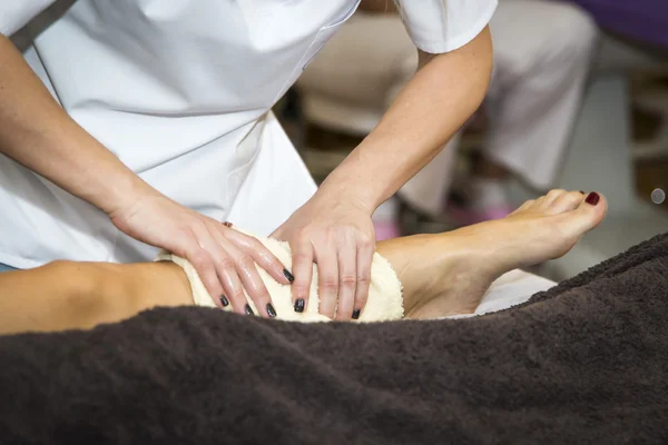 Massaging of young woman — Stock Photo, Image