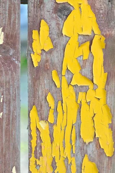 Wooden planks with cracked yellow color paint — Stock Photo, Image
