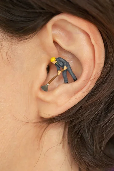 Hygiene Essentials Concept Miniature Man Using Broom Cleaning Ears — Stock Photo, Image