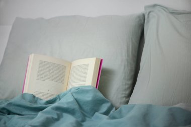 Cconcept Book on Pillow in Bed. Bedtime Story