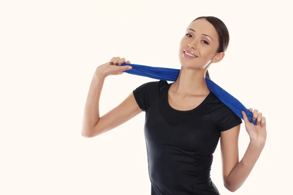 Portrait of young woman wearing sport clothes on a white backgro — Stock Photo, Image