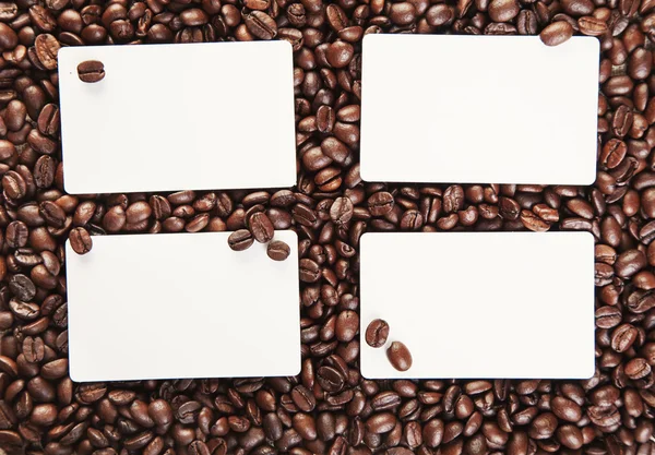 Four note with space for text on the background of coffee beans — Stock Photo, Image