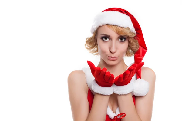 Süße junge Frau in rotem Weihnachtsmannhut und Kostüm küsst dich agai — Stockfoto