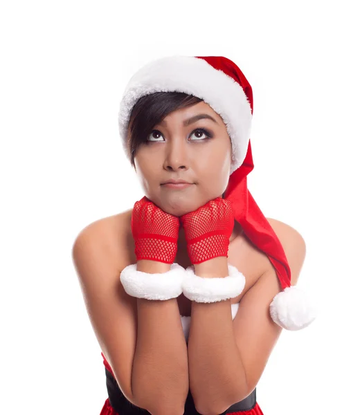 Santa natal mulher olhando para o lado pensando feliz e pla — Fotografia de Stock