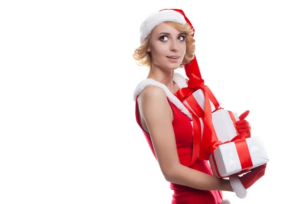 Young woman wearing Santa Claus costume holding colorful gift bo — Stock Photo, Image