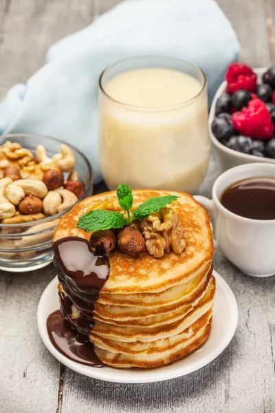 Pancakes with chocolate and nuts — Stock Photo, Image