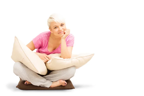 Blonde caucasian woman is sitting on the floor — Stock Photo, Image