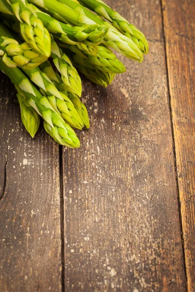 Asparagus over wooden table — Stock Photo, Image
