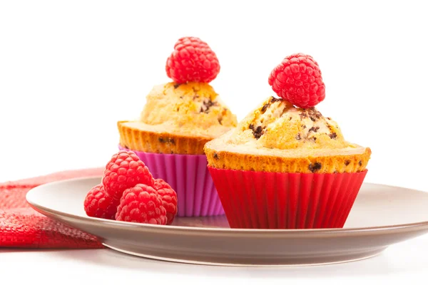 Tasty cupcakes with raspberries — Stock Photo, Image