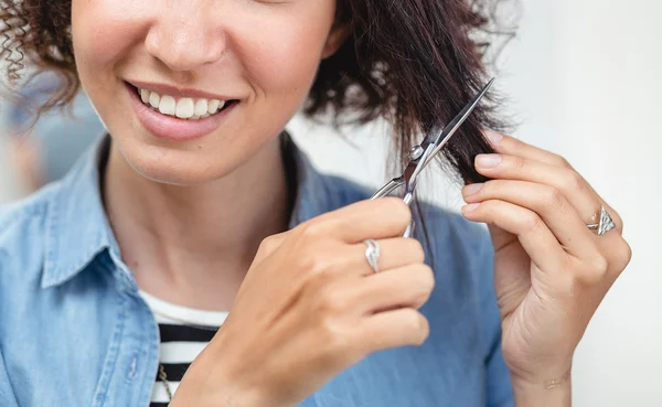 Portrait of the brown hair women with hairdresser's scissors in — Stock Photo, Image