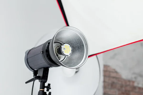 Studio flash impulse reflector on white Royalty Free Stock Images