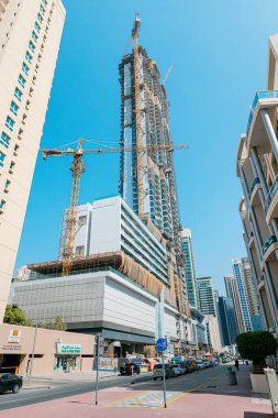 23 Şubat 2021, Dubai, BAE: Dubai ve Birleşik Arap Emirlikleri 'nde bir gökdelen inşa edildi. Gayrimenkul kavramı ve çalışanların çalışma koşulları