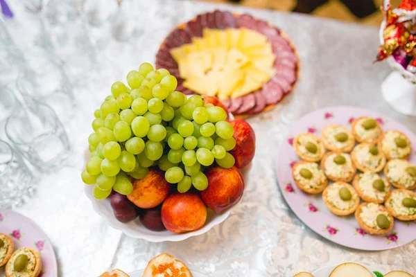 Assorted snacks served on the table — Stock Photo, Image