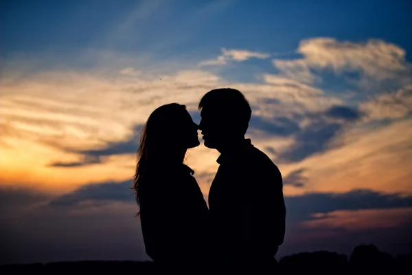 Silhouette of kissing couple