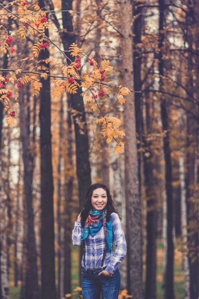 laughing hipster cow-girl in autumn park