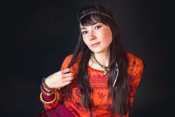 american Indian woman in ethnic ritual clothes in the Studio