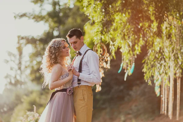 Bride and groom in rustic style outdoor. Vintage toned — Stock Photo, Image