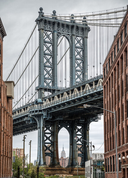 NEW YORK, USA - Apr 29, 2016: Manhattan Bridge and Empire State Building seen from Brooklyn, New York