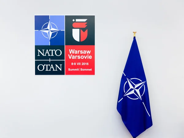 Emblem and the flag of NATO sammit in Poland — Stock Photo, Image