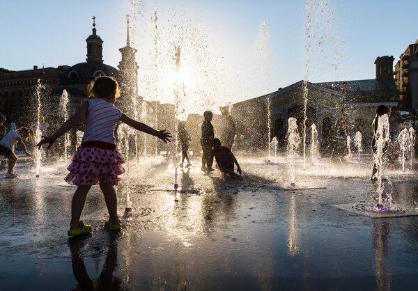 Children playing in a fountain