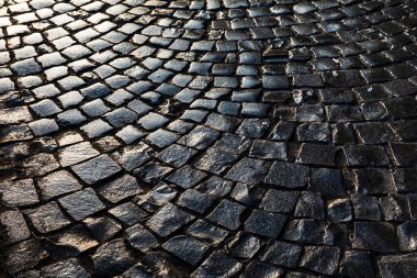 Eski şehrin sokakları. Taş kaldırım dokusu. Soyut yapılandırılmış arkaplan.