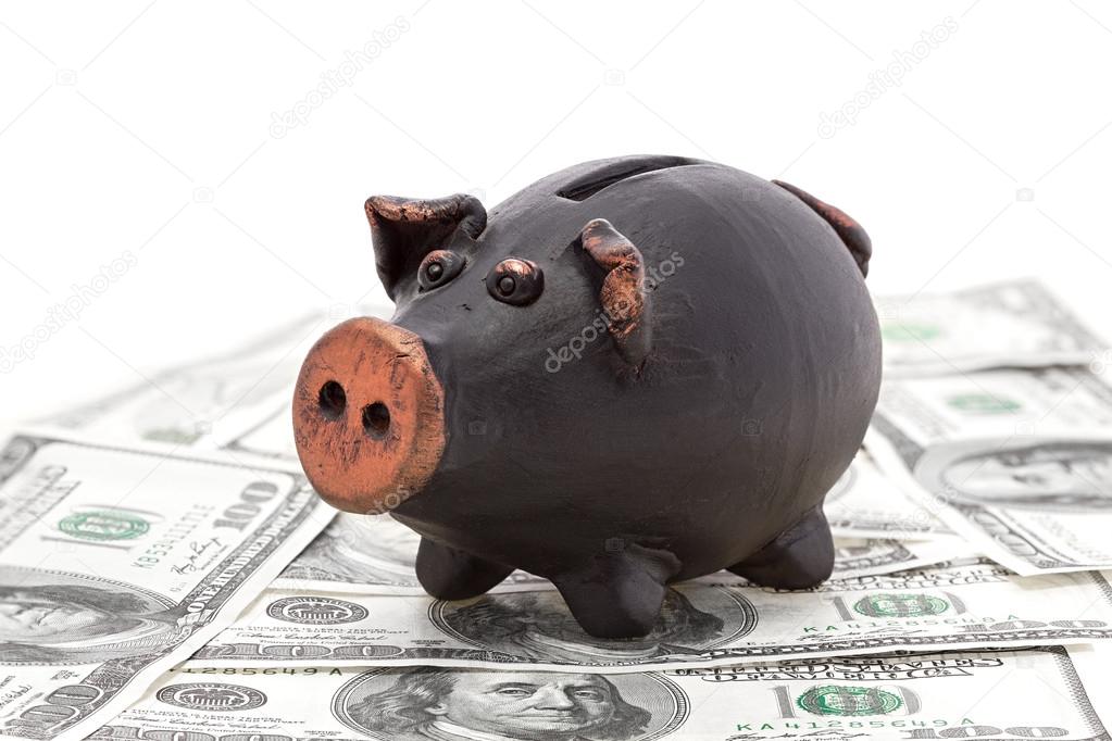 Money and black piggy bank