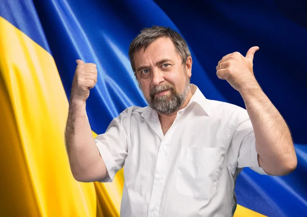 Daumen hoch Zeichen gegen ukrainische Flagge — Stockfoto