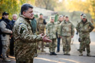 President of Ukraine Petro Poroshenko communicates with soldiers clipart