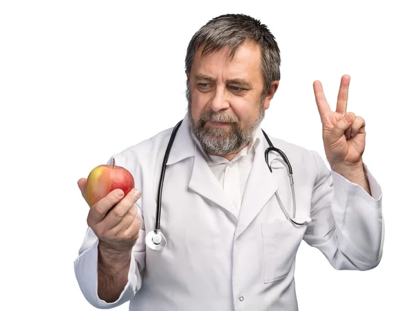 Doctor giving apple for healthy eating — Stock Photo, Image