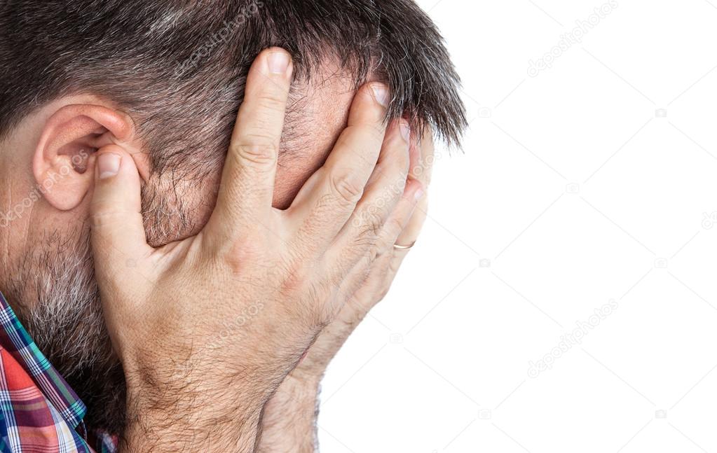 Elderly man suffering from a headache