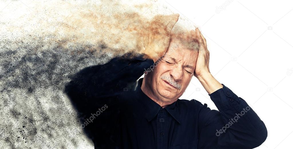 Elderly man suffering from a headache