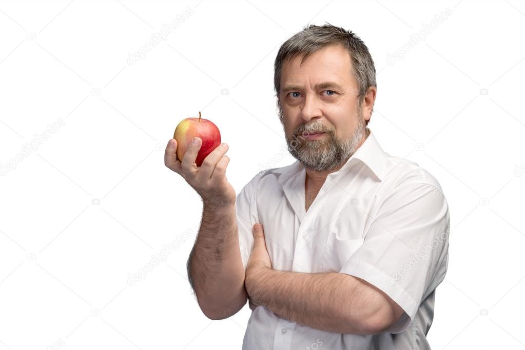 Middle-aged man holding a red apple 