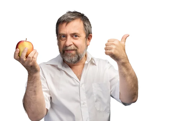 Smiling middle-aged man holding a red apple — Stock Photo, Image