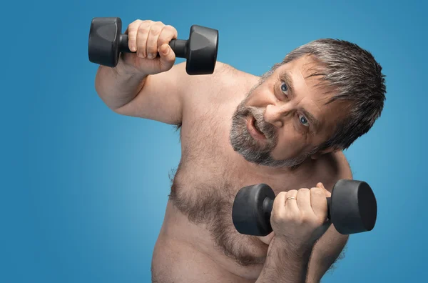 Hombre haciendo ejercicio con pesas — Foto de Stock