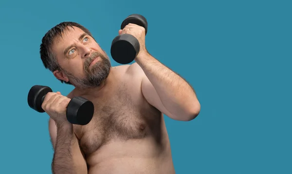 Idős, kövér ember gyakorolja: a súlyzó — Stock Fotó