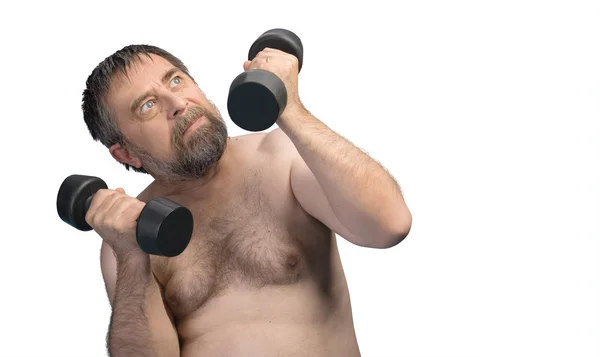 Elderly fat man exercising with dumbbells — Stock Photo, Image