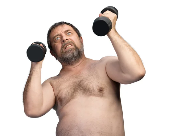 Az ember súlyzókkal gyakorol — Stock Fotó