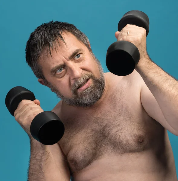 Man exercising with dumbbells — Stock Photo, Image