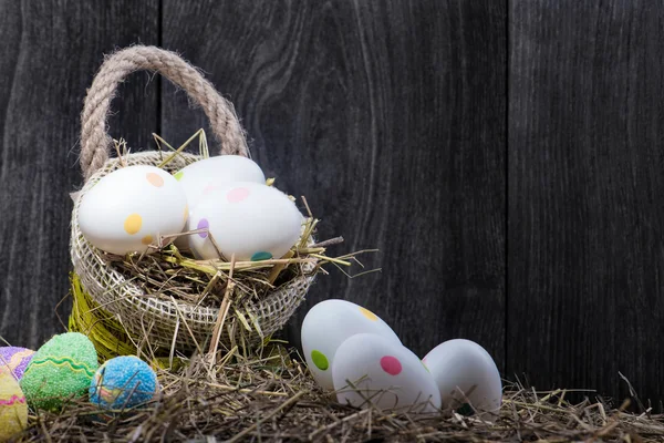 Basket with Easter eggs and easter cake — Stock Photo, Image