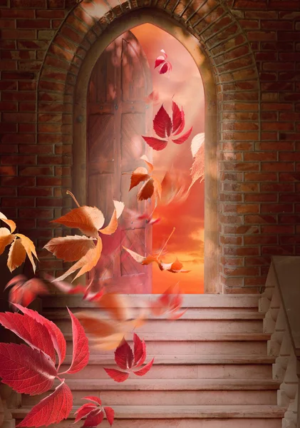 Autumn leaves fall through the open door — Stock Photo, Image