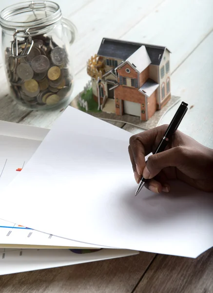 Hand signing property loan — Stock Photo, Image