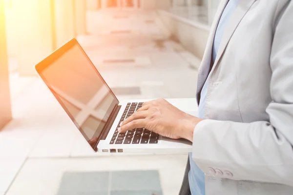 Indian male with laptop — Stock Photo, Image